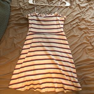 White dress with red grey and blue stripes